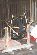 to Jpeg K Indigo thread ready for being wound from the hank onto spools for weaving in a house in Amarapura, Shan State 9809f03.jpg