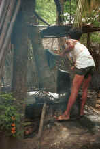 Jpeg 36K Draining off the excess dye over the dye bath - Amarapura, Shan State 9809f29.jpg