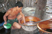Jpeg 32K The first stage in the mixing of the rinsing mixture - adding sago and water - Amarapura, Shan State 9809g01.jpg