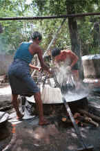 Jpeg 46K Plunging a second handful of fresh cotton hanks of thread into the dye bath - Amarapura, Shan State 9809g05.jpg
