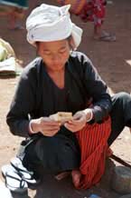 to 26K Jpeg 9809H32 Pa'O market trader counting her money at the Kalaw 5-day rotating market, Shan State.