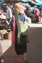 to 29K Jpeg 9809I07 Pa'O woman at Kalaw market, Shan State, with a typical Shan bag over her shoulder and a green striped one on her head carrying her supplies