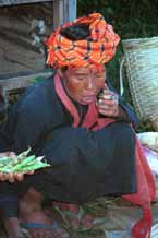 to 27K Jpeg 9809I18 Pa'O market trader in the Kalaw 5-day rotating market puffing on her cheroot.