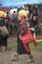 to 31K Jpeg 9809M36 Pa'O woman striding through Nampan 5-day rotating market, Lake Inle, Shan State