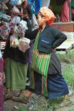 to 37K Jpeg 9809N15 Close examination of goods for sale by two Pa'O women at Nampan 5-day rotating market, Lake Inle, Shan State