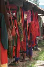 to 30K Jpeg 9809O03 Pa'O women amongst a mass of shoulder bags on a stall in Nampan 5-day rotating market, Lake Inle, Shan State