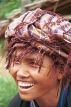 to 28K Jpeg 9809R34 Pa'O woman at Ywama floating market, Lake Inle, Shan State peering through her headdress fringe