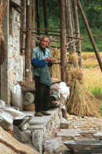 Jpeg 38K Bouyei old man with his pipe outside his house in Bi Ke village, Mi Gu township, Zhenfeng county, Guizhou province 0010s11.jpg