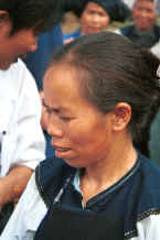 Jpeg 23K Bouyei woman selling textiles - Bi Ke village, Mi Gu township, Zhenfeng county, Guizhou province 0010s27.jpg