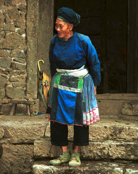 Miao woman coming our of her stone house - Chang Tion village, Cheng Guan township, Puding county, Guizhou province 0010w03.jpg