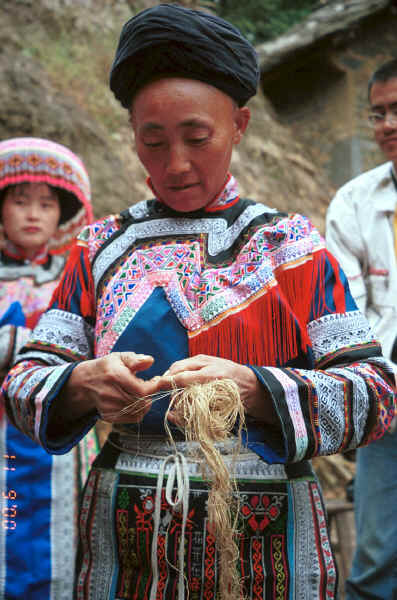 Miao woman demonstrating splicing ramie - Chang Tion village, Cheng Guan township, Puding county, Guizhou province 0010w11.jpg