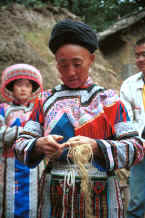 Jpeg 40K Miao woman demonstrating splicing ramie - Chang Tion village, Cheng Guan township, Puding county, Guizhou province 0010w11.jpg