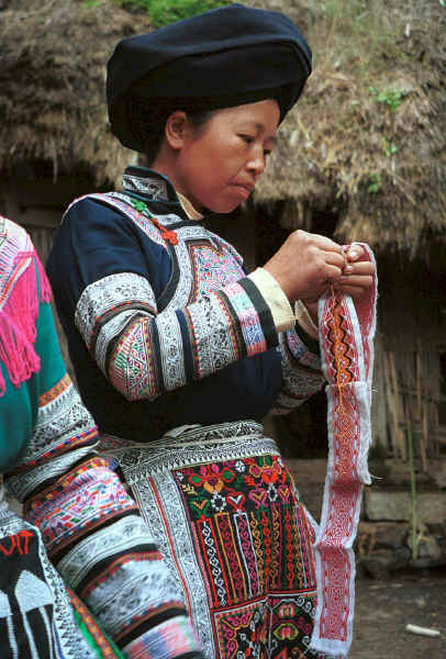Miao woman demonstrating embroidery - Chang Tion village, Cheng Guan township, Puding county, Guizhou province 0010w13.jpg
