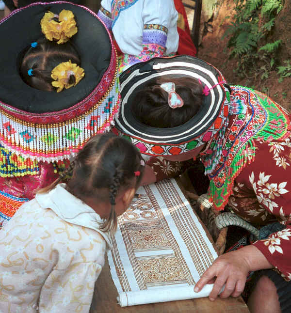 Focusing on developing the batik design - We saw some very fine batik work in this village - Da Shu Jia village, Xin Zhou township, Longlin county, Guangxi province 0010i08.jpg
