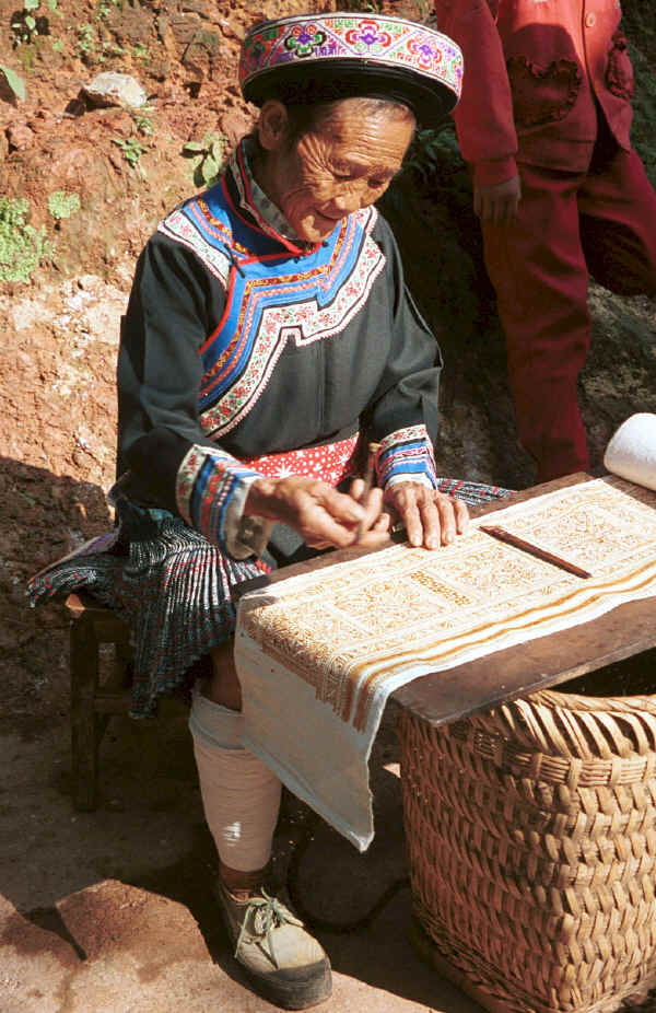 Clean Water Miao old lady examining her fine batik - Da Shu Jia village, Xin Zhou township, Longlin county, Guangxi province 0010i12.jpg