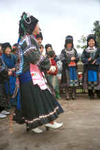 Jpeg 37K Black Miao girls dancing in their festival costumes - Dai Lo village, Shi Zi township, Ping Ba county, Guizhou county 0010z21.jpg