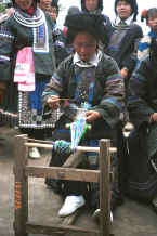 Jpeg 34K Black Miao woman demonstrating weaving braids - Dai Lo village, Shi Zi township, Ping Ba county, Guizhou county 0010z24.jpg