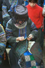 Jpeg 37K Black Miao girl demonstrating her embroidery on a piece for a woman's jacket - Dai Lo village, Shi Zi township, Ping Ba county, Guizhou county 0010z27.jpg