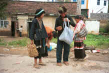 Jpeg 38K Side Comb Miao couple checking up on their purchases,  De Wo market,  De Wo township, Longlin county, Guangxi province 0010g32.jpg