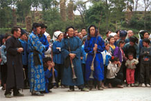 to Jpeg 53K  0110D37 Musicians resting in Gan He village, Ya Rong township, Huishui county, Guizhou province, south-west China. The people living in this village are known as Qing Miao.
