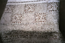 to Jpeg 59K  0110E19 A cotton cloth with a quite thickly applied wax resist before any indigo dyeing in Gan He village, Ya Rong township, Huishui county, Guizhou province. This is a Qing Miao (or Bouyei/Miao as there has been much intermarriage and the costume is very mixed). 