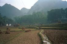 to Jpeg 41K  0110E26 Fields and hills around Gan He village, Ya Rong township, Huishui county, Guizhou province. This is a Qing Miao (or Bouyei/Miao) village as there has been much intermarriage and the costume is very mixed). 