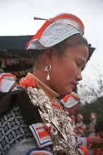 to Jpeg 59K 0111G22 Gejia dance troupe performing in Ma Tang village, Kaili City, Guizhou province in November 2001. The apparently wax resist fabric in their costume - at least the headdress, apron and sleeves of the blouse - are now generally made from commercially printed fabric which imitates the Gejia traditional wax resist designs 