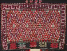 to Jpeg 68K Detail of embroidery on the back of a Qi Li woman's embroidered blouse purchased in 2005 in in the style of those from Changjiang in Hainan Island