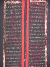 to Jpeg 64K Detail of the embroidered front opening of a Qi Li woman's embroidered blouse purchased in 2005 in in the style of those from Changjiang in Hainan Island