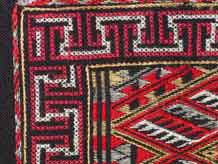 to Jpeg 66 Detail of embroidery on the back of a Qi Li woman's embroidered blouse purchased in 2005 in in the style of those from Changjiang in Hainan Island