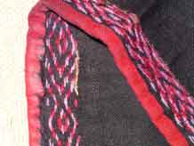 to Jpeg 60K Detail of embroidery around the cuff of a sleeve of a Qi Li woman's embroidered blouse purchased in 2005 in in the style of those from Changjiang in Hainan Island