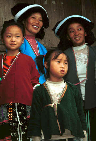 Side comb Miao women and children watching us make our way through their village - Long Dong village, De Wo township, Longlin country, Guangxi province 0010e03.jpg