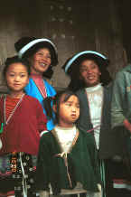 Jpeg 28K Side comb Miao women and children watching us make our way through their village - Long Dong village, De Wo township, Longlin country, Guangxi province 0010e03.jpg