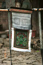 Jpeg 45K Side comb Miao baby carrier with the top and ties decorated in indigo batik and the bottom in embroidery - Long Dong village, De Wo township, Longlin country, Guangxi province 0010e13.jpg