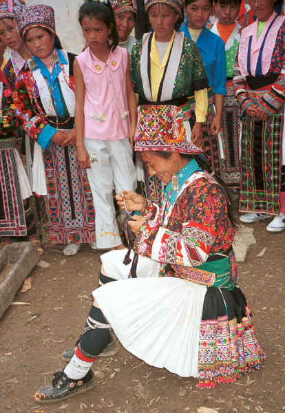 White Miao woman working on her embroidery, probably for a head wrapping in Ma Wo village, Zhe Lang township, Longlin county, Guangxi province 0010j09.jpg