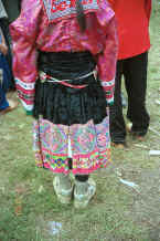 Jpeg 38K Back view of a White Miao woman showing her embroidered and beaded ties  - Ma Wo village, Zhe Lang township, Longlin county, Guangxi province 0010k08.jpg