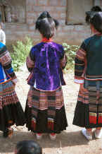 Jpeg 40K Back view of Side Comb Miao girls in festival finery - Pao Ma Cheng village, Teng Jiao township, Xingren country, Guizhou province 0010n11.jpg