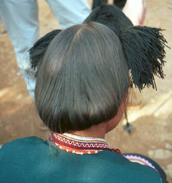 Side Comb Miao - back view of unmarried girl's hair dressed with wool - Pao Ma Cheng village, Teng Jiao township, Xingren country, Guizhou province 0010n31.jpg