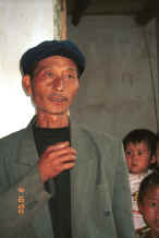 Jpeg 20K Head man of the Side Comb Miao village,  Pao Ma Cheng, Teng Jiao township, Xingren country, Guizhou province 0010o02.jpg