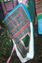 Jpeg 42K Side Comb Miao baby carrier decorated mainly with batik.  Note that the batik design is very similar to the swirls favoured in the cut out embroidery - Pao Ma Cheng village, Teng Jiao township, Xingren country, Guizhou province 0010o09.jpg