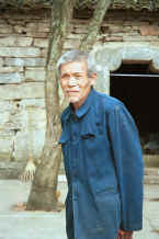 Jpeg 26K Old man watching us enter the village - Sha Jiao village, Wan Teng township, Xingyi metropolitan area, Guizhou province 0010l22.jpg