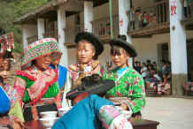 Jpeg 43K Organising the welcome drinks watched from the school by children and other villagers - Sha Jiao village, Wan Teng township, Xingyi metropolitan area, Guizhou province 0010l33.jpg