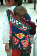 Jpeg 30K A baby carrier bought in the market but with an added patchwork band on the top - Sha Jiao village, Wan Teng township, Xingyi metropolitan area, Guizhou province 0010m17.jpg