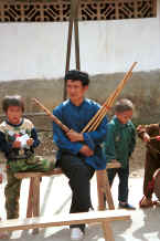 Jpeg 32K Musician with his lushen pipes and two small boys - Sha Jiao village, Wan Teng township, Xingyi metropolitan area, Guizhou province 0010m25.jpg