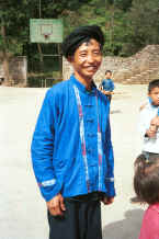 Jpeg 30K One of the musicians who has given his lushen pipes to the small boy behind him who wanted to play them - Sha Jiao village, Wan Teng township, Xingyi metropolitan area, Guizhou province 0010m26.jpg