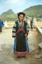 Jpeg 39K Old Bouyei textile seller modelling the jacket which I had just bought - Shitou village, Huanggousu township, Zhen Nin county, Guizhou province 0010u10.jpg