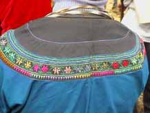 to Jpeg 57K Detail of back of woman's festival jacket in Songtao Miao Autonomous County, Tongren Prefecture, Eastern Guizhou Province, 5 February, 2004.