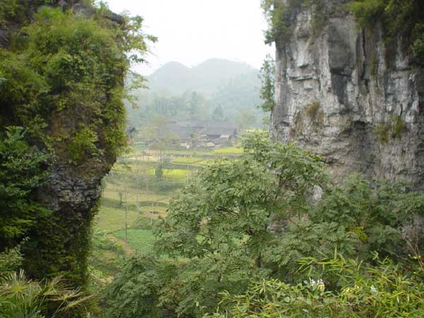 45K Jpeg Looking through the karst limestone cliffs down into a village in Songtao Miao Autonomous County, Tongren Prefecture, eastern Guizhou Province. 