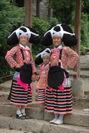 to Jpeg 71K The full festival finery of the Long Horned Miao 