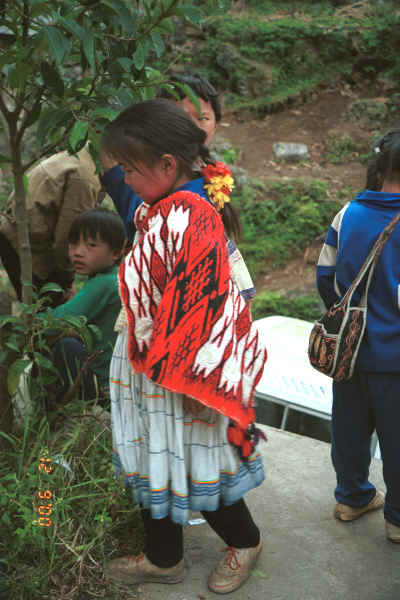 Young Big Flower Miao girl in her festival finery - Xian Ma village, Hou Chang township, Puding county, Guizhou province 0010x09.jpg
